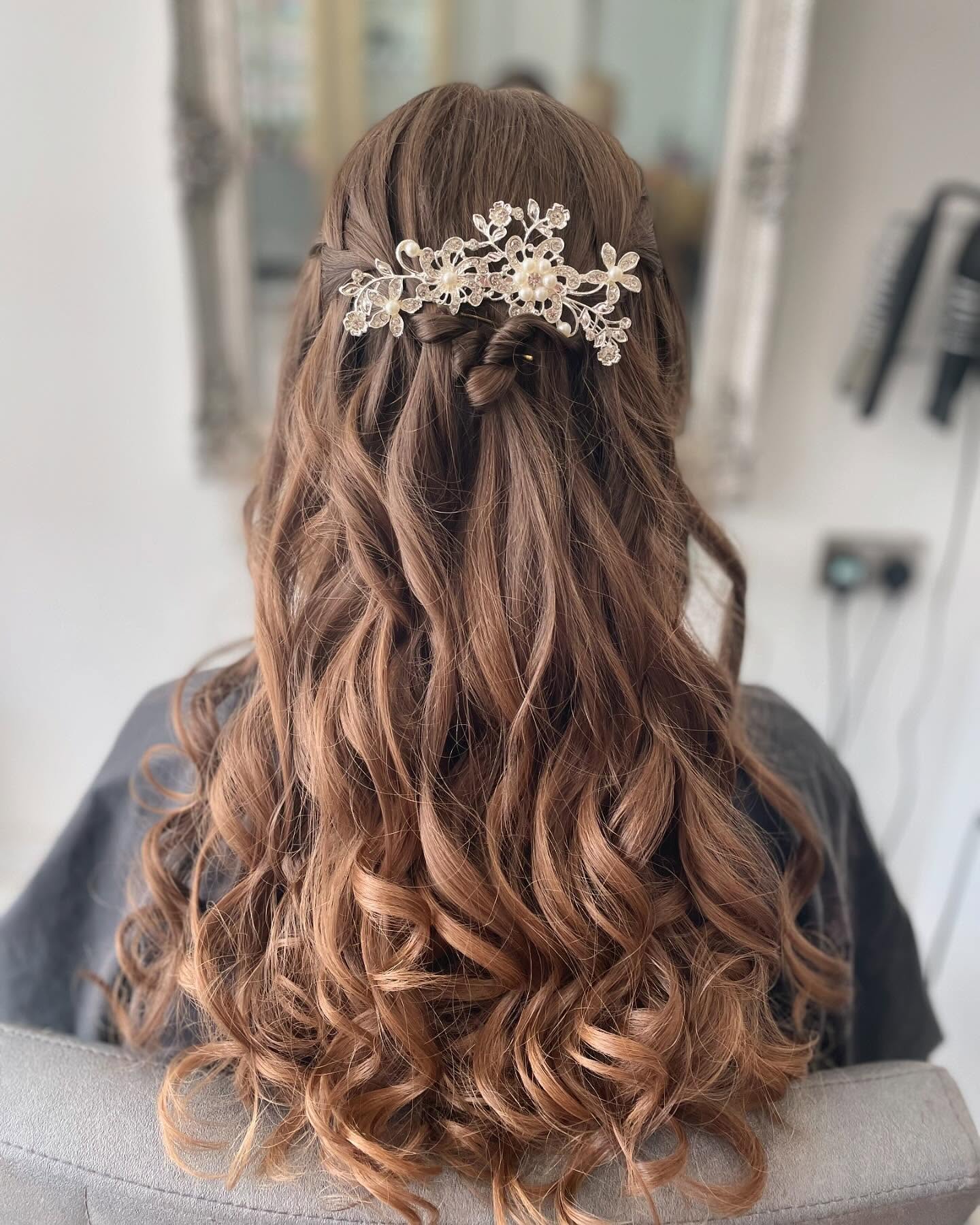 Bridal half-up hairstyle with curls created in Hurstpierpoint.