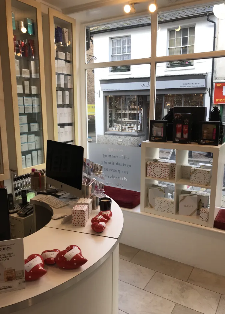 Hair Obsession reception area with retail haircare products, front window display and customer welcome desk.