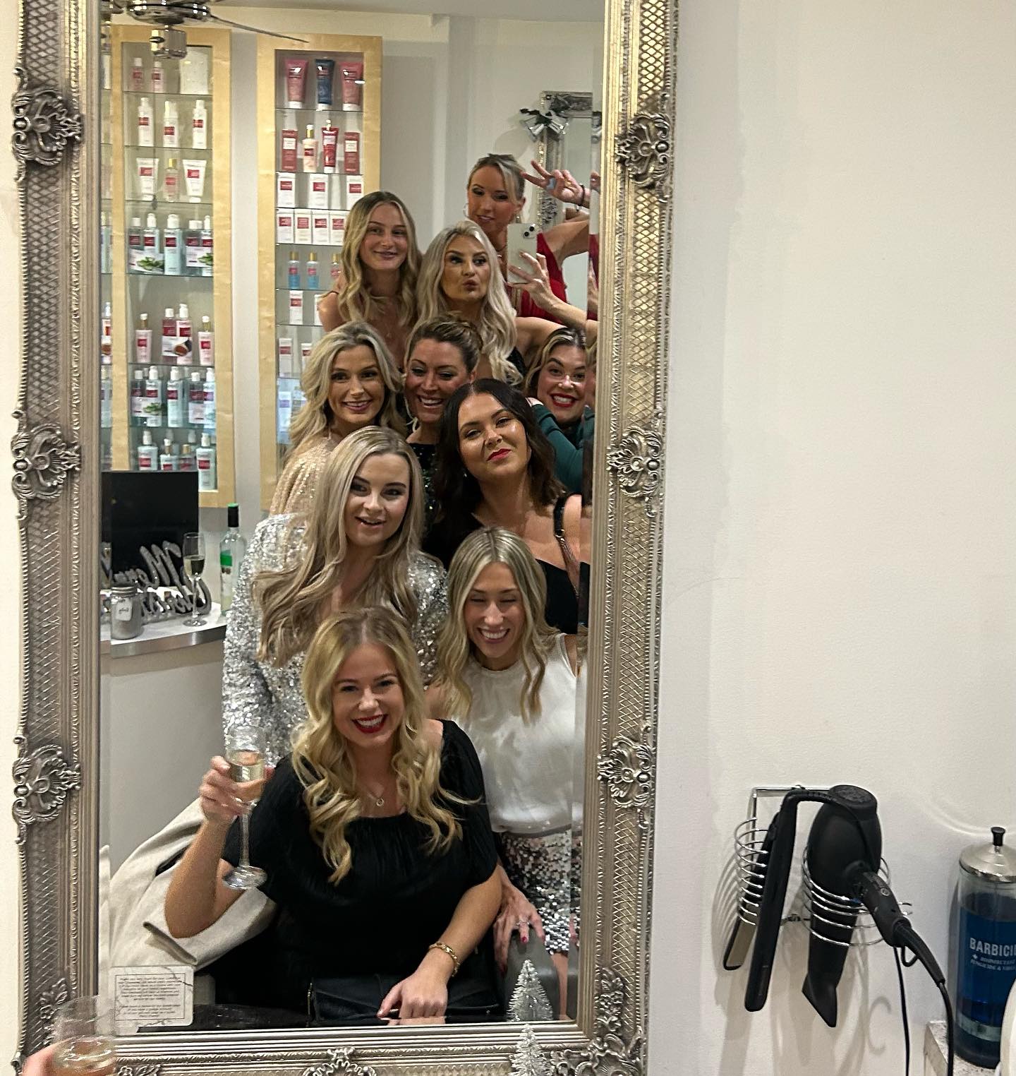 Group photo inside Hair Obsession salon.